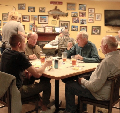 Four men at restaurant table