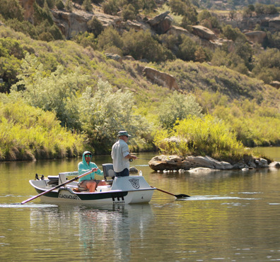 Guide and client fishing texas hole on the san juan river nm