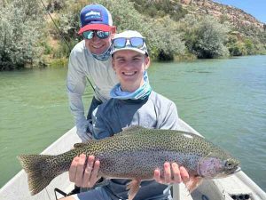 Father son with large rainbow trout