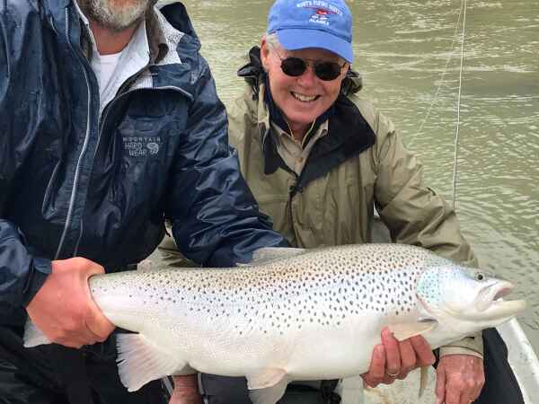 Guide and customer with large san juan trout