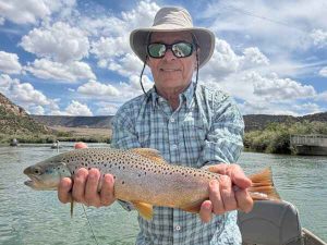 Texas hole san juan river man with brown trout