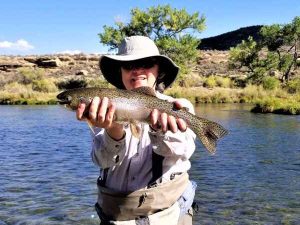 San Juan Wade Fisher Holding Rainbow Trout