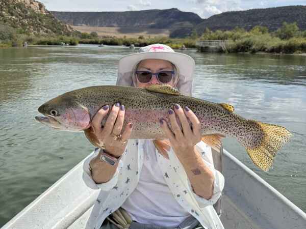2026 10 05 senior lady holding large rainbow trout san juan river